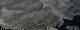  vue depuis le Viso sur la Pointe Joanne au centre cachant le col de Soustre. A droite dans l'ombre le col de Valante. A gauche le Punta Seras à 2993et le col qui permet d'atteindre le vallon de Soustre. (c) Christophe ANTOINE
800*305 pixels (35432 octets)(i4488)